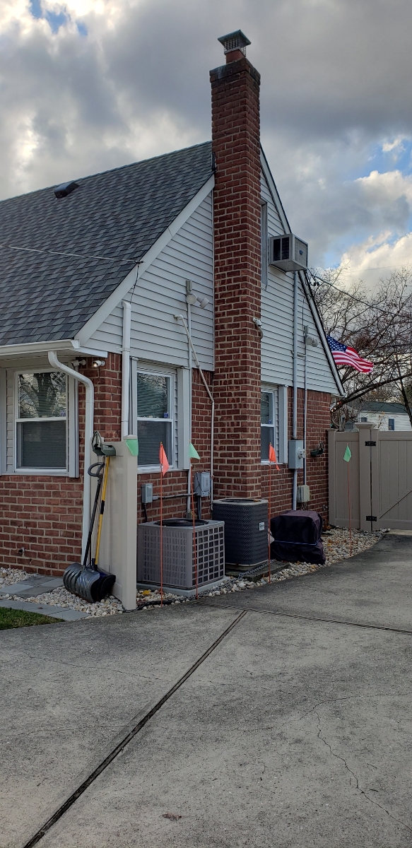 Professional chimney repointing restoring brick joints in Hicksville, NY